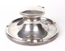 A George V silver capstan inkwell and liner.