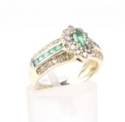 A Continental emerald and diamond dress ring.