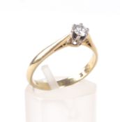 A mid 20th century gold and diamond solitaire ring.