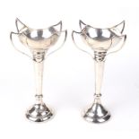 A pair of silver Art Nouveau four handled vases.