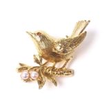 A vintage 9ct gold, garnet and cultured-pearl bird brooch.