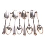 Seven Georgian silver serving spoons.