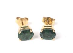 A pair of vintage emerald single stone stud earings.