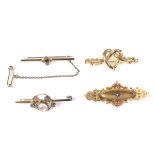 Four Victorian and later gold brooches.