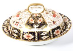 A Royal Crown Derby imari pattern muffin dish and domed cover.