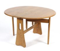 An Ercol gateleg oak dining table.