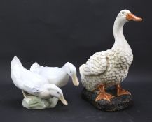 A large pair of Royal Copenhagen ducks and another ceramic figure of a duck.