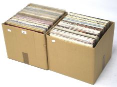 A collection of vinyl records and albums.
