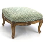 A 20th century upholstered foot stool.