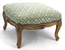 A 20th century upholstered foot stool.