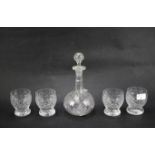 Four cut glass baluster tumblers and a Victorian shaft and globe engraved decanter and stopper.