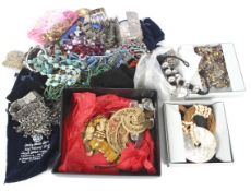 Assorted costume jewellery and foreign coinage.