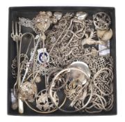 An assortment of silver and white metal jewellery and collectables.