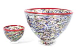 Two Kosta Boda glass bowls. Both multi coloured with flecks and swirls, largest bowl diam. 17.