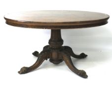 A Victorian burr walnut oval breakfast table.