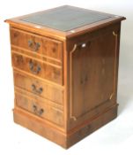 A contemporary veneered filing cabinet modelled as a chest of drawers.