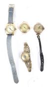 An assortment of ladies wrist watches including gold examples.