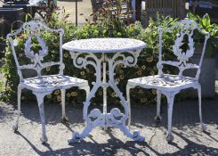 A 20th century white painted aluminum garden table and two chairs.