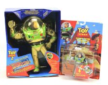 Two boxed Buzz Lightyear figures.