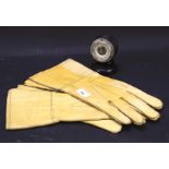 A pair of 1942 leather driving gloves and an ebonised barometer.