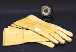 A pair of 1942 leather driving gloves and an ebonised barometer.