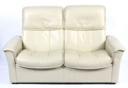 A Stressless reclining chair, a footstool and a two-seater sofa.
