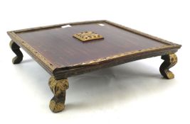 A wooden oriental table.