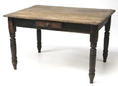A 20th century stained pine table.