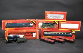 An assortment of Hornby OO gauge locomotives, carriages and freight stock.