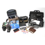 An assortment of camera, accessories and related parts.