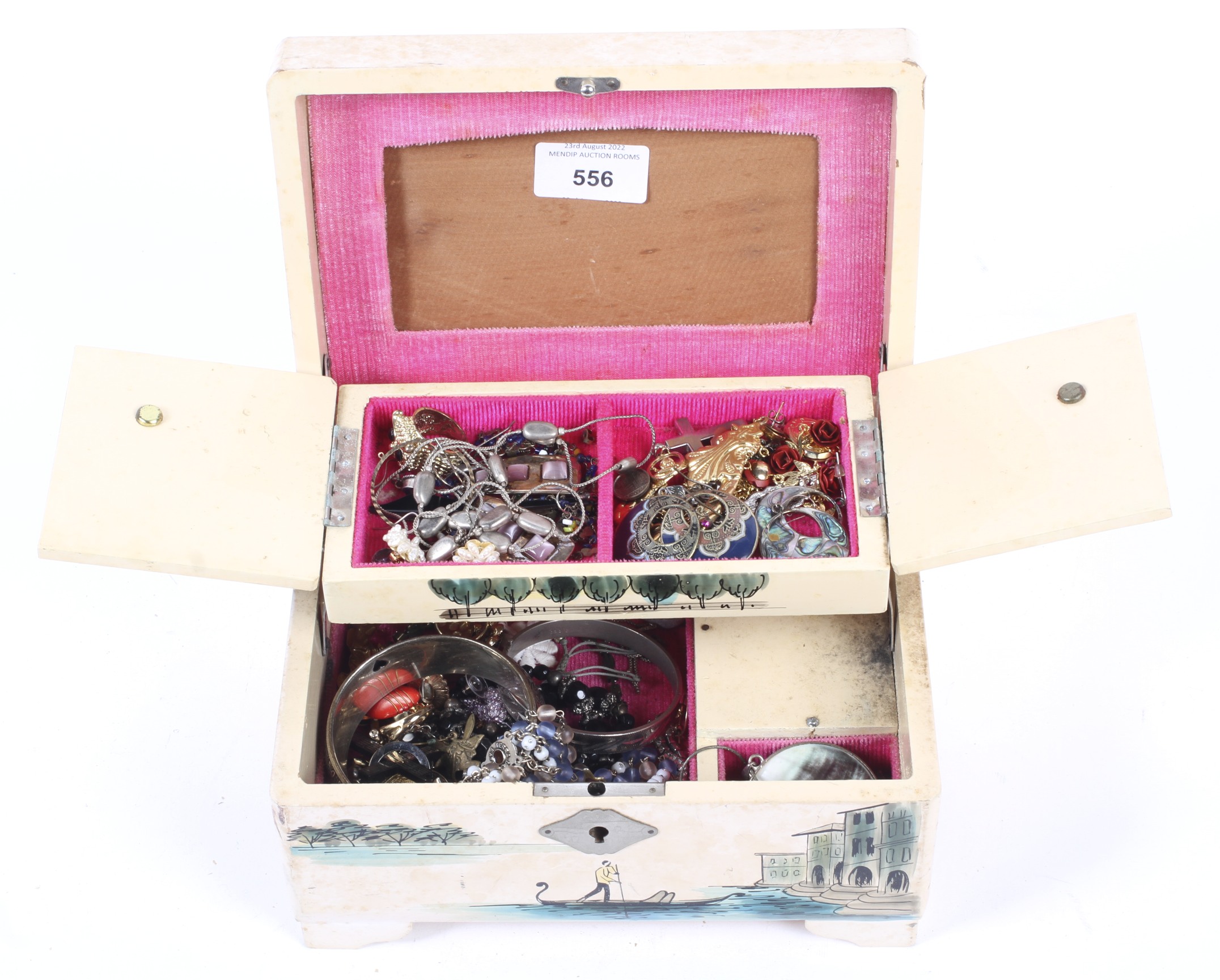 Costume jewellery in a vintage jewellery box.