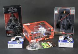 An assortment of modern Star Wars toys.