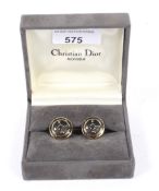 A pair of Christian Dior compass cufflinks.