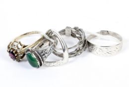 A collection of five ladies silver and white metal rings. To include gem set examples, 12.