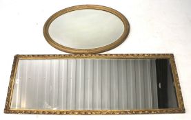 Two gilt framed bevelled edge wall mirrors.