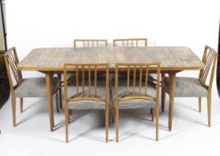 A 1960s dining table and six chairs designed by Archie Shine for Robert Heritage.
