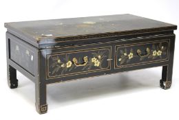 A 20th century black painted Chinese table.