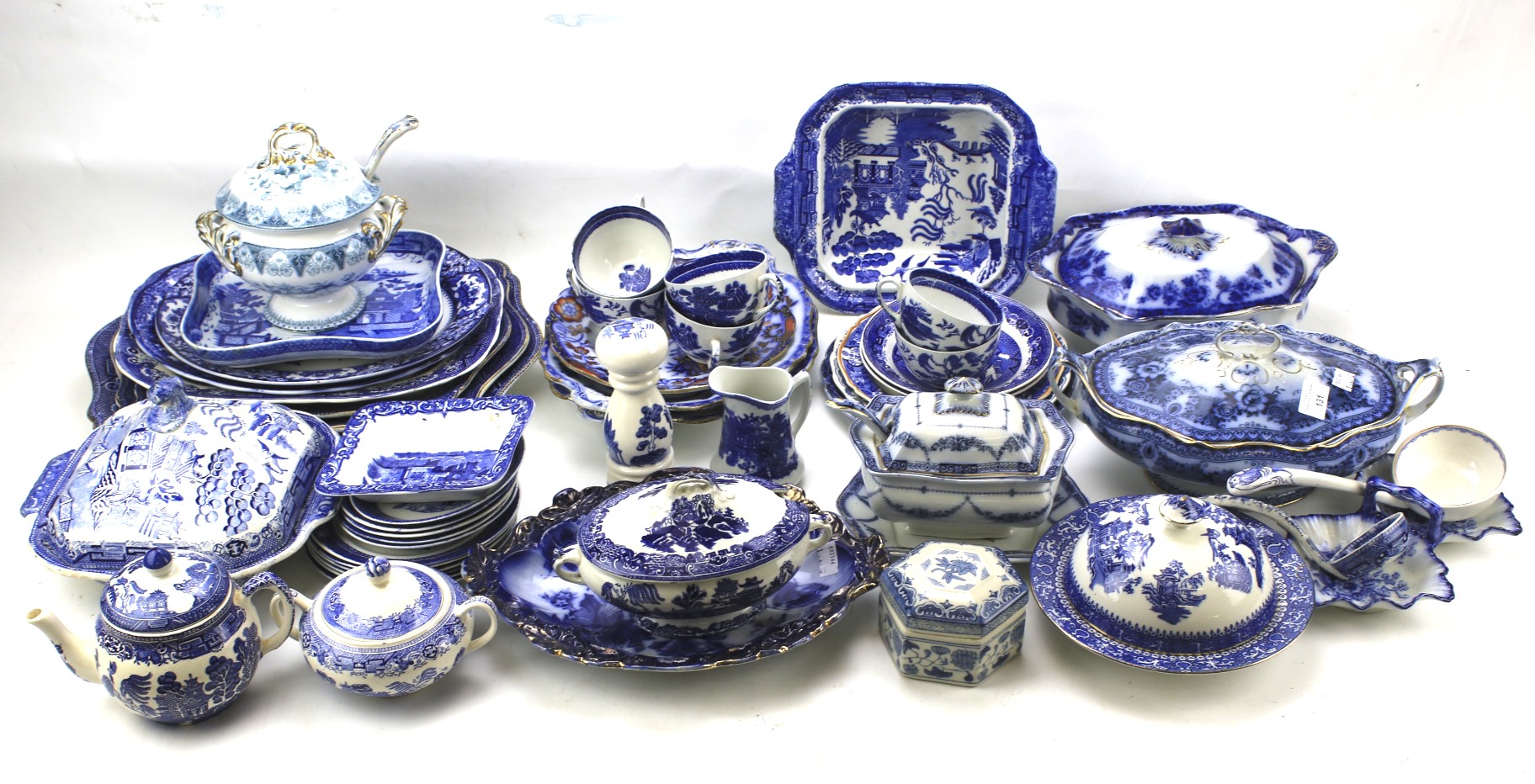 A large assortment of blue and white ceramics.