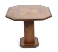 An Art Deco style walnut coffee table of octagonal form.