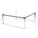 A large circa 1970s chrome and heavy glass coffee table.