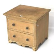 A 20th century pine pot cupboard. With hinged top, raised on bracket supports, L43.