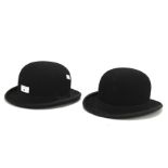 Two vintage black felt bowler hats.