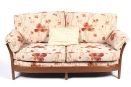A high back Ercol four piece lounge suite.