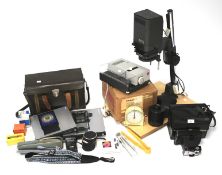 A collection of photographic equipment, including a Leitz/Leica slide projector,