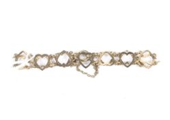 A 9ct gold heart link bracelet. Approximately 4.