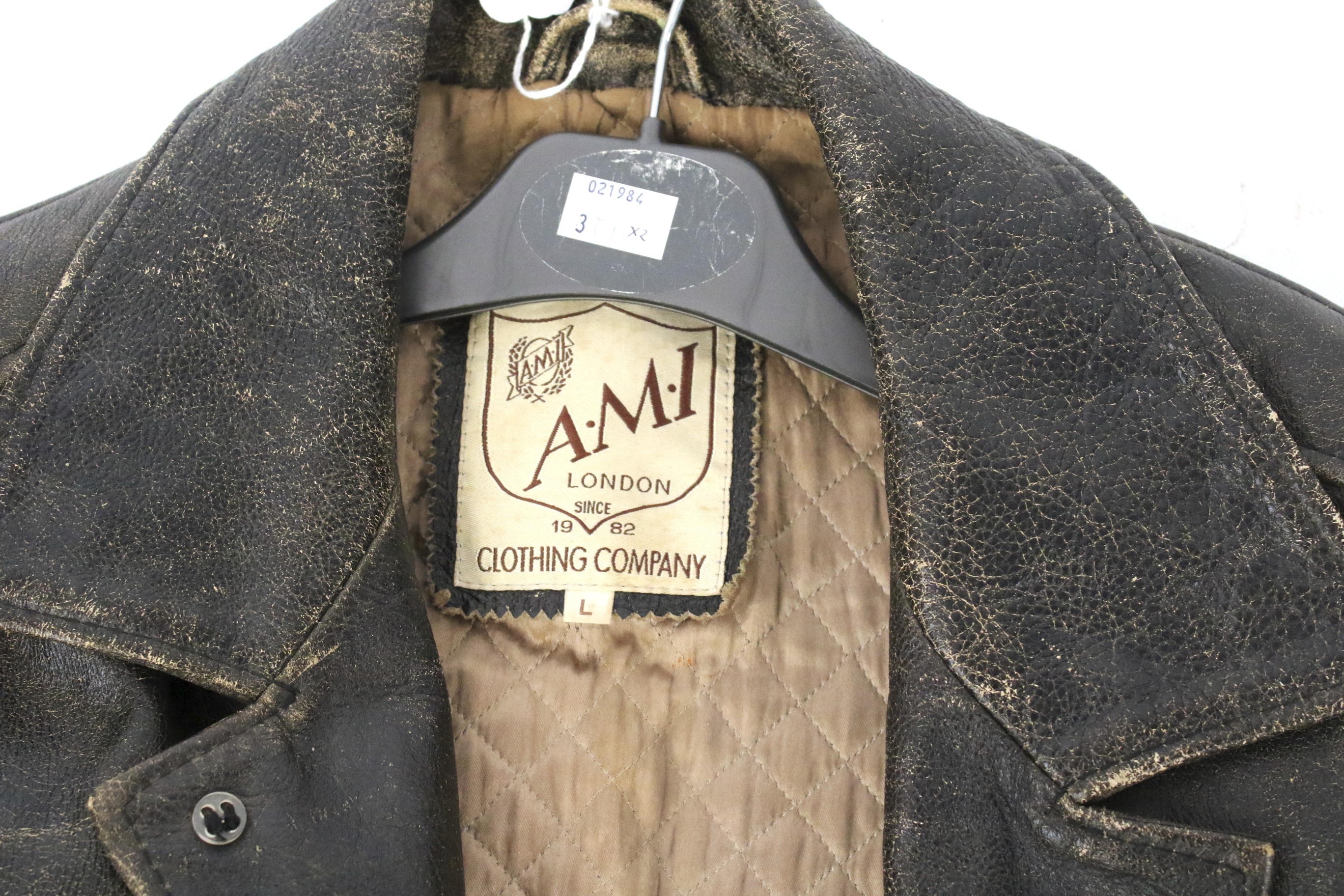 A vintage leather jacket and woollen coat. The jacket by A.M.I. - Image 2 of 3