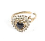 A 9ct gold heart shaped cluster ring.