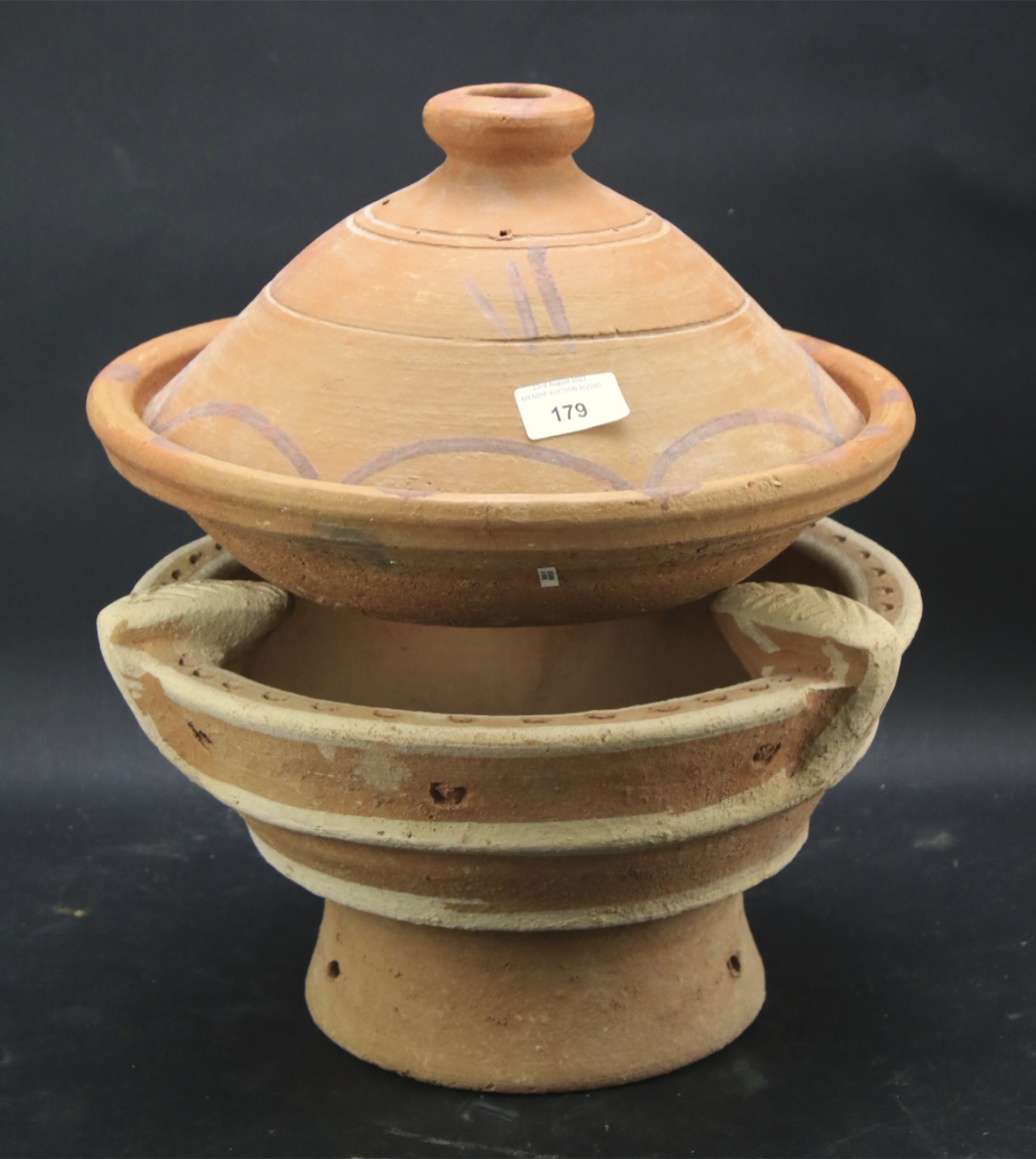 A terracotta dish and tureen.