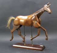 A 20th century articulated artist's model of a horse.