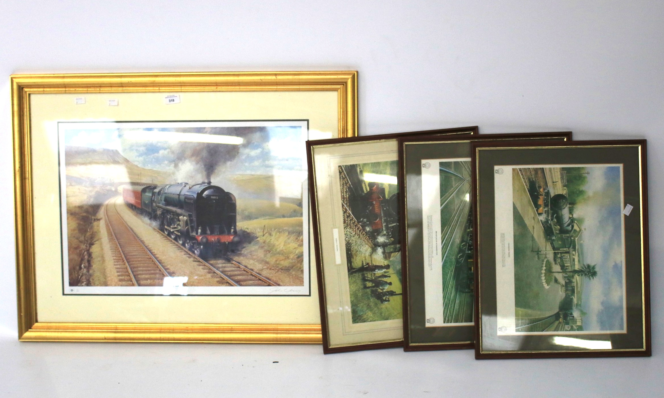 Four prints depicting trains.